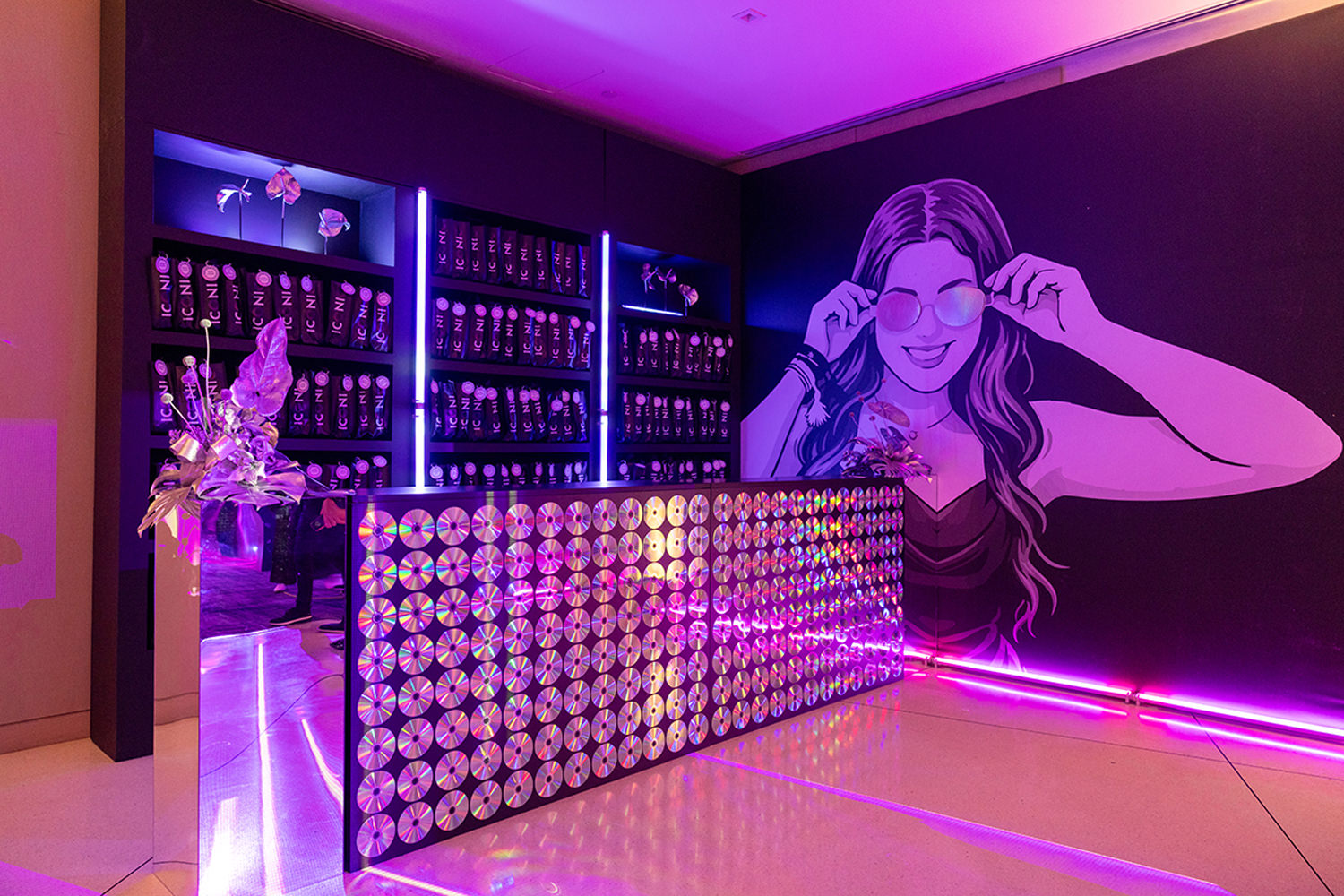 Custom luxury event favor display with branded guest gifts and immersive nightlife-inspired decor