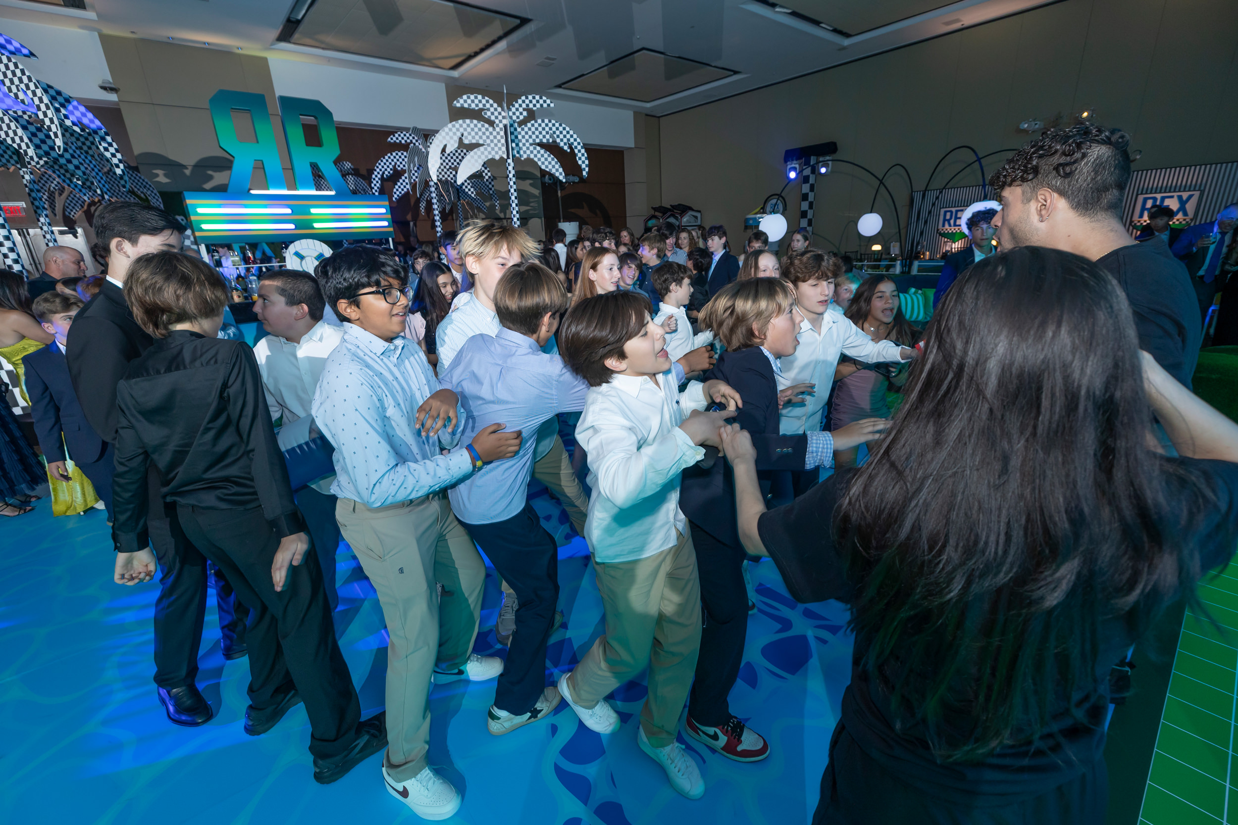 Guests filling the dance floor during a luxury Miami bar mitzvah celebration