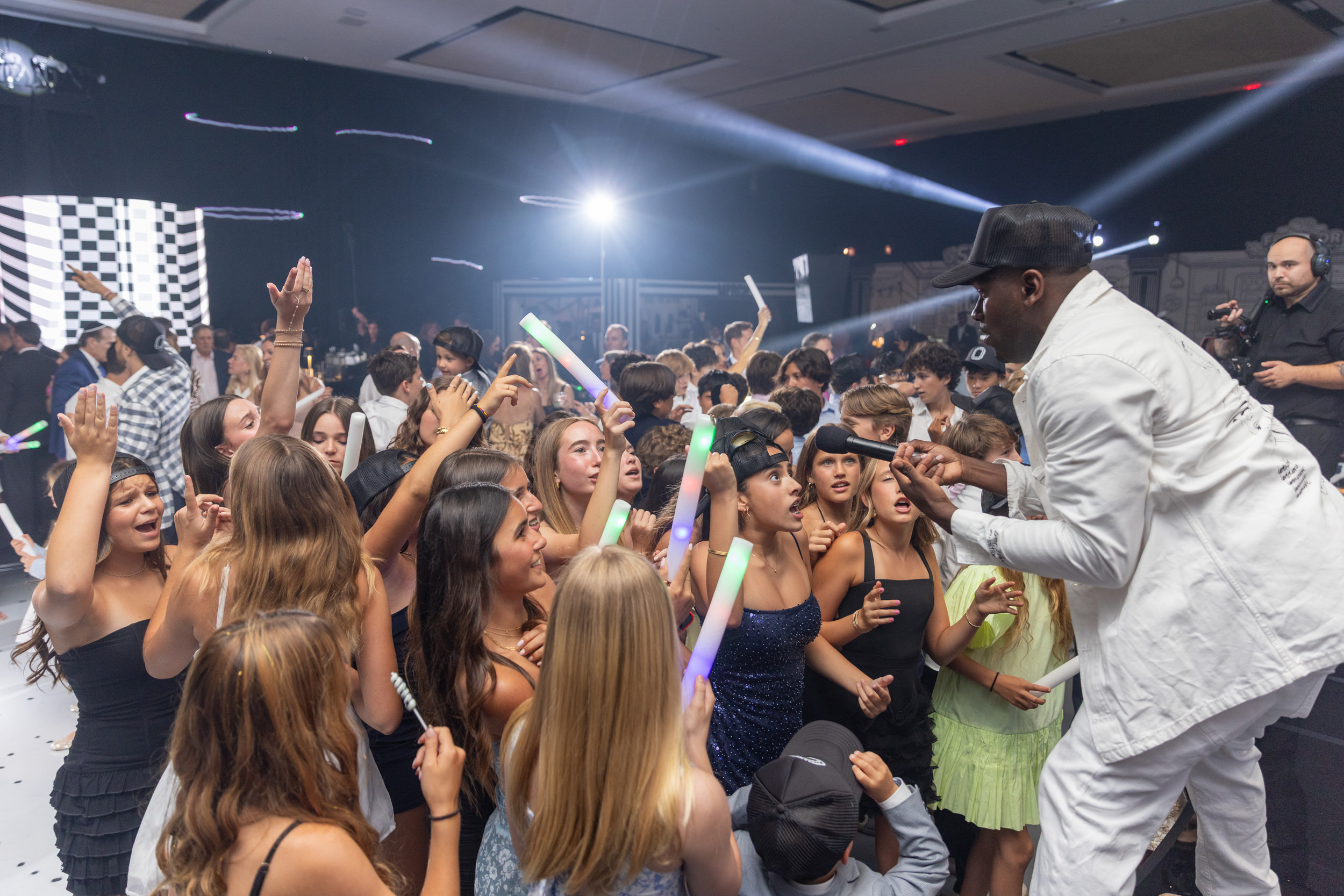 Guests filling the dance floor during a high-energy Miami bar mitzvah celebration