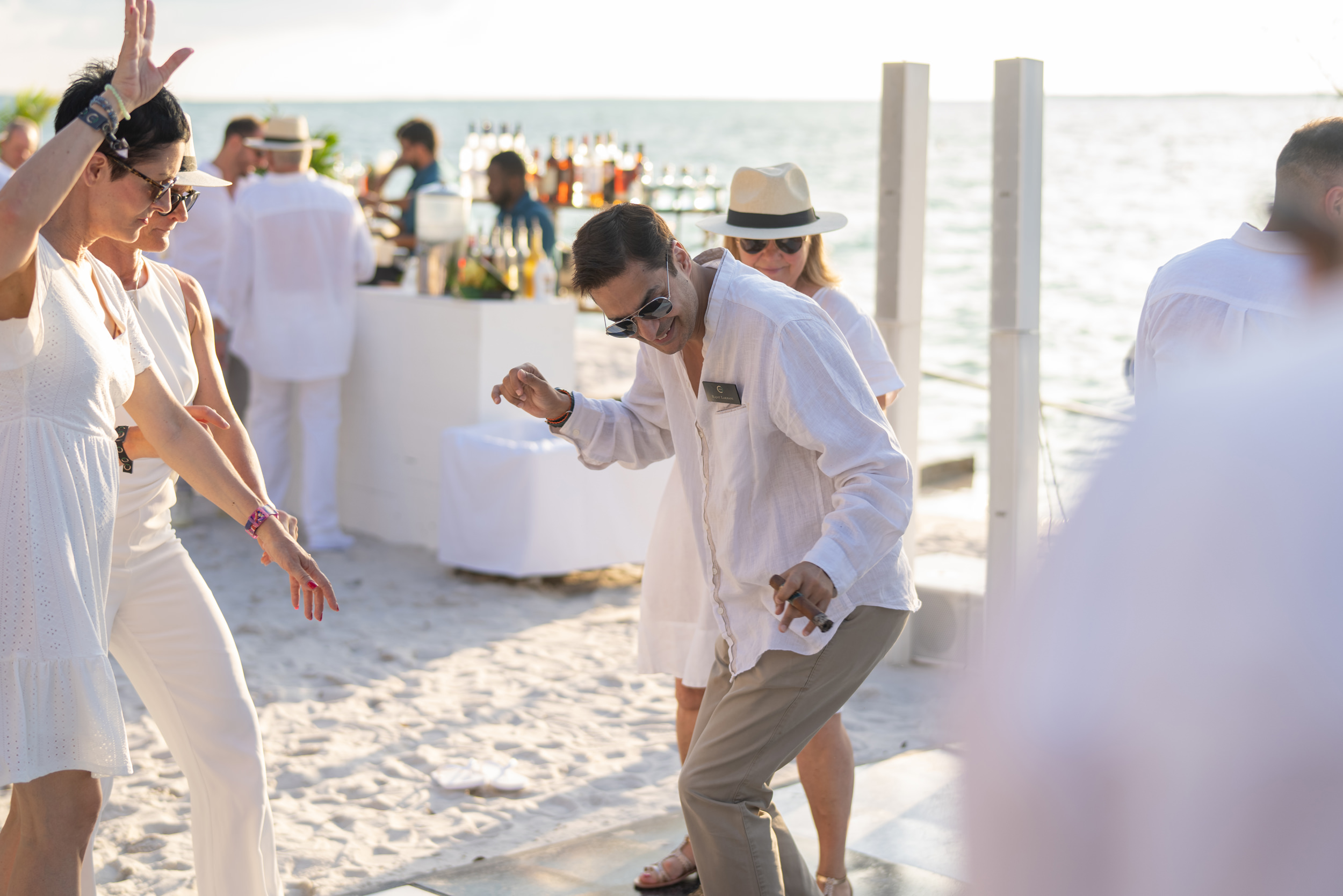 Guests enjoying live entertainment during a luxury beachfront cocktail reception