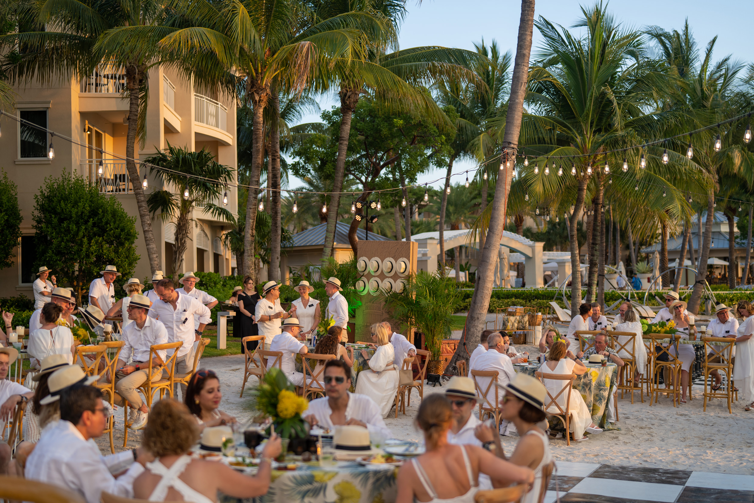 Luxury beachfront corporate event with outdoor dining and guest lounges