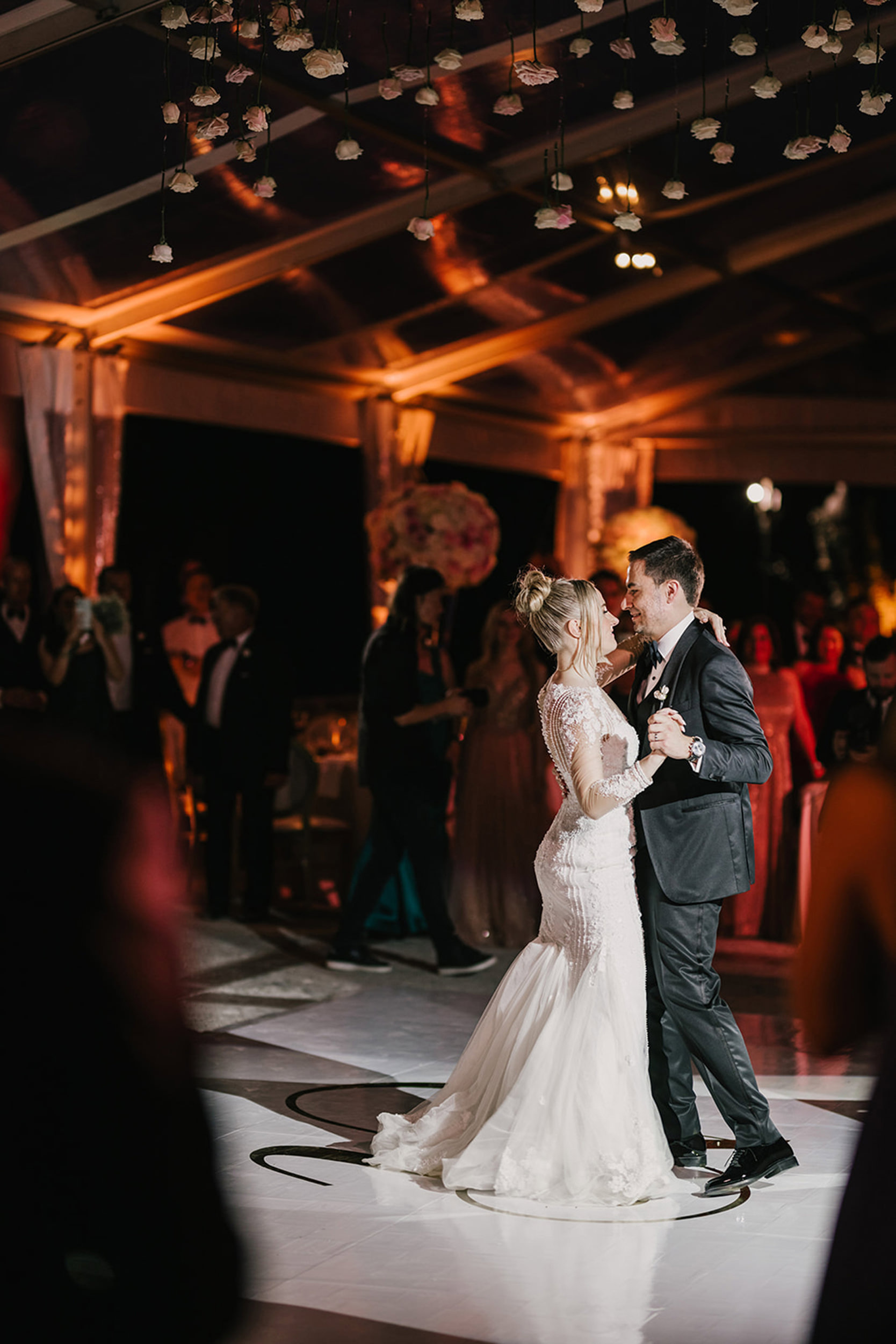 Bride and groom sharing their first dance during a luxury wedding reception