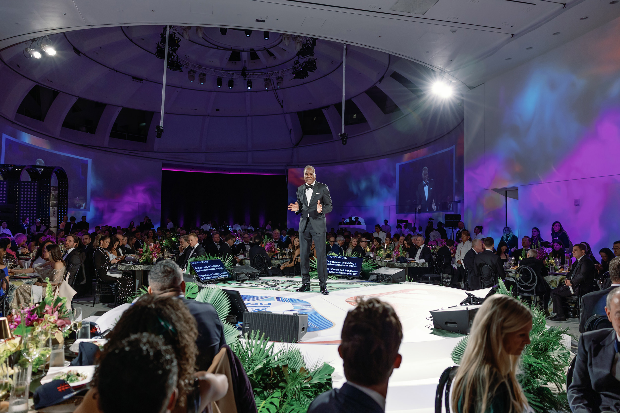 Keynote presentation during a large-scale nonprofit gala with immersive stage design